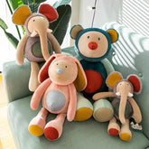 Plush Animal Asst(50CM) featuring colorful stuffed animals on a couch, ideal for children and playrooms.